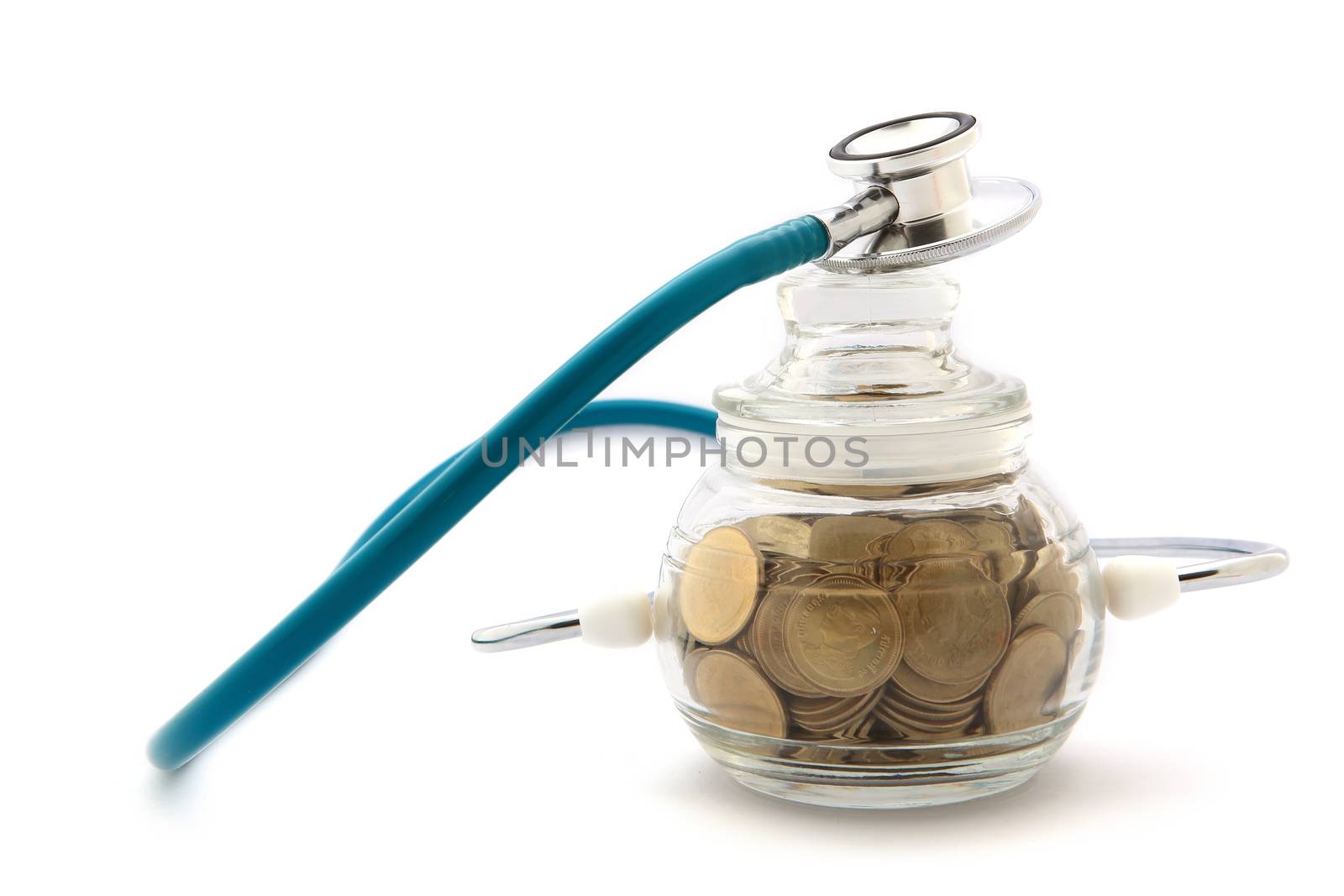 stethoscope with coins in the savings, financial concept by rufous