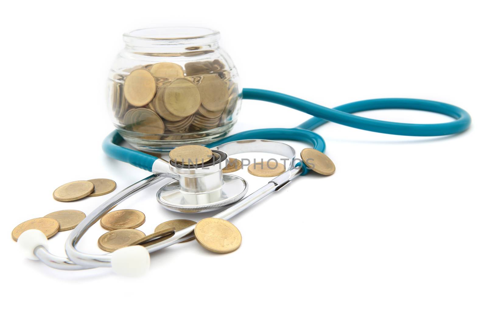 stethoscope with coins in the savings, financial concept