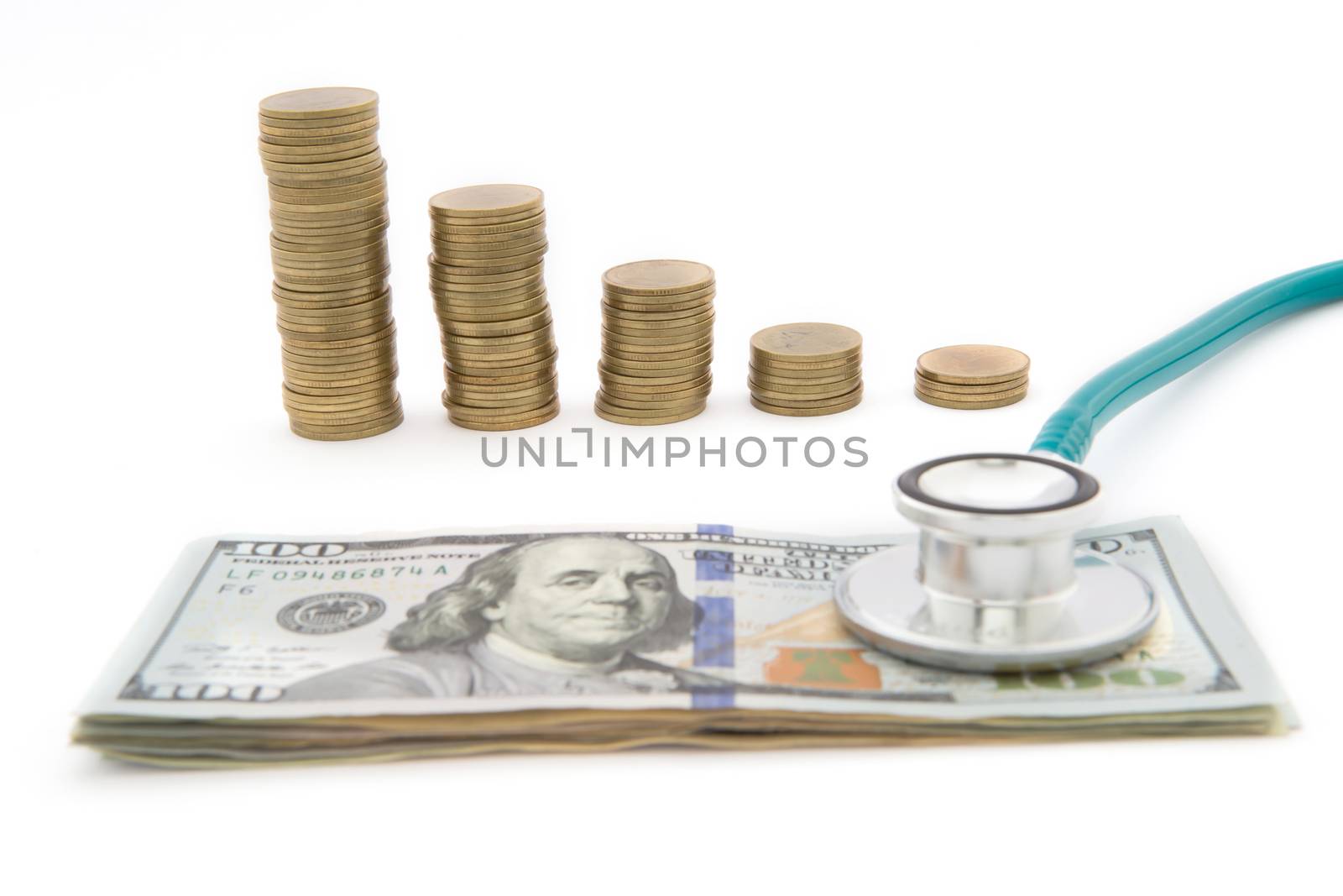 Stack of coins and money and stethoscope by rufous