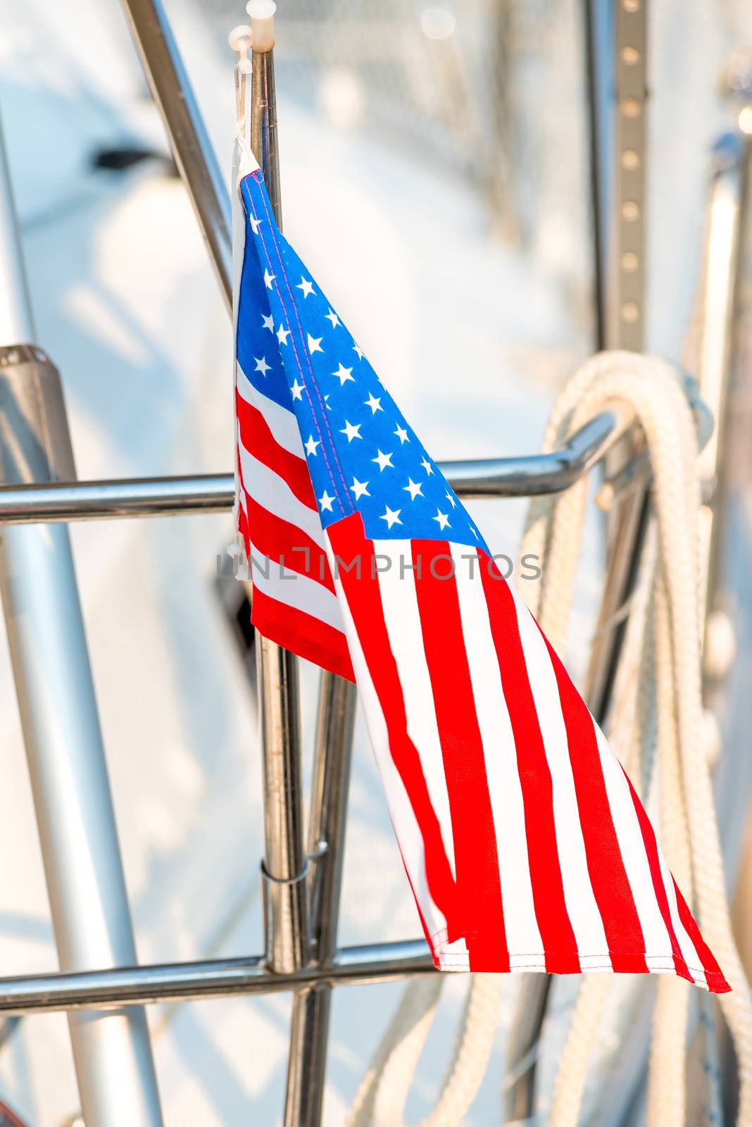 waving flag of the United States on a yacht