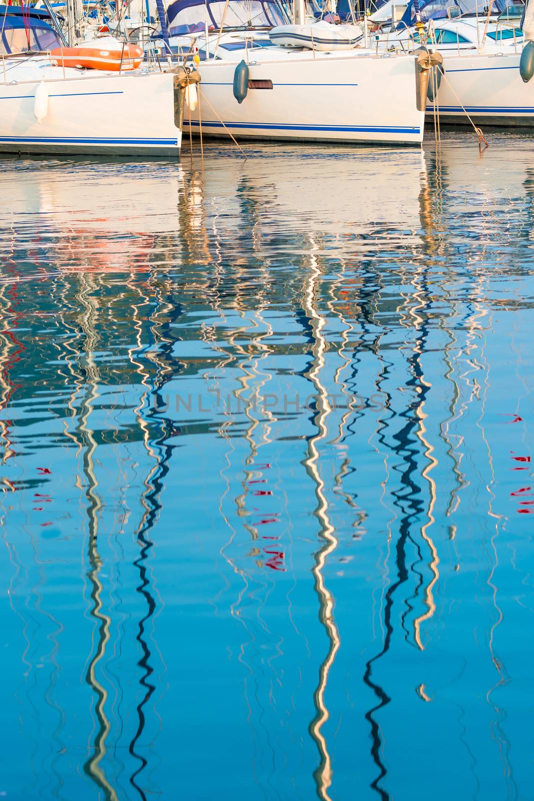 reflection of the masts of yachts in sea water by kosmsos111