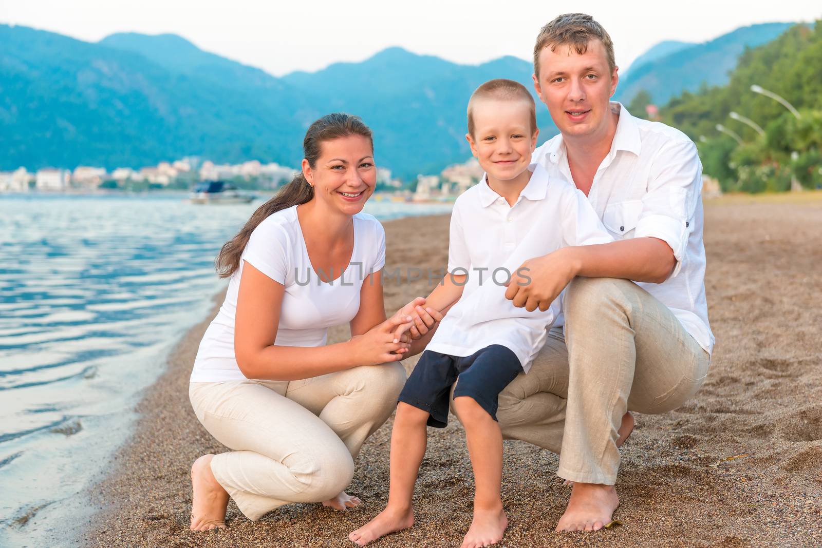 Happy Family with child on holiday at the sea