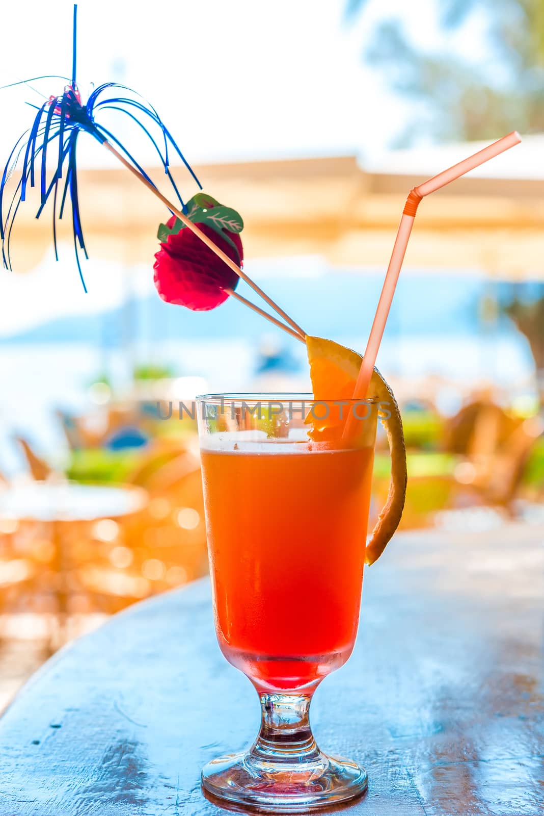 glass of delicious fruit cocktail closeup