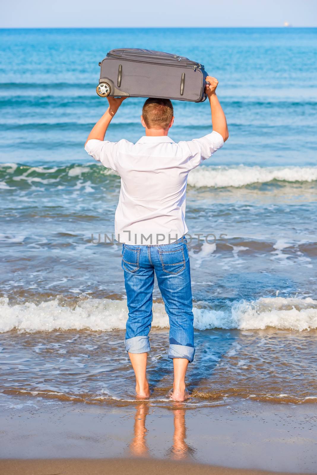 man with a suitcase goes to sea