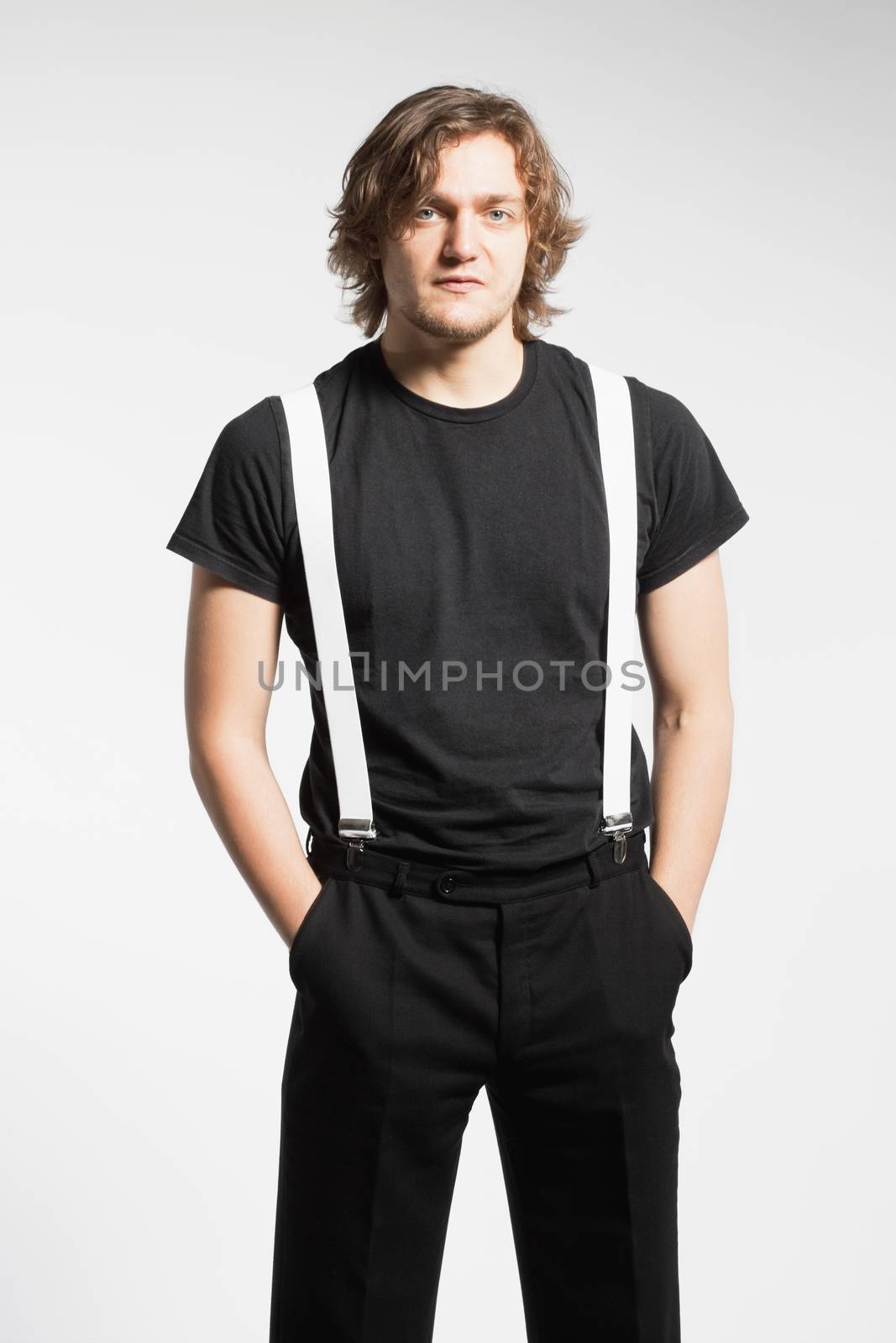 Portrait of a Young Man with Brown Hair and Suspenders