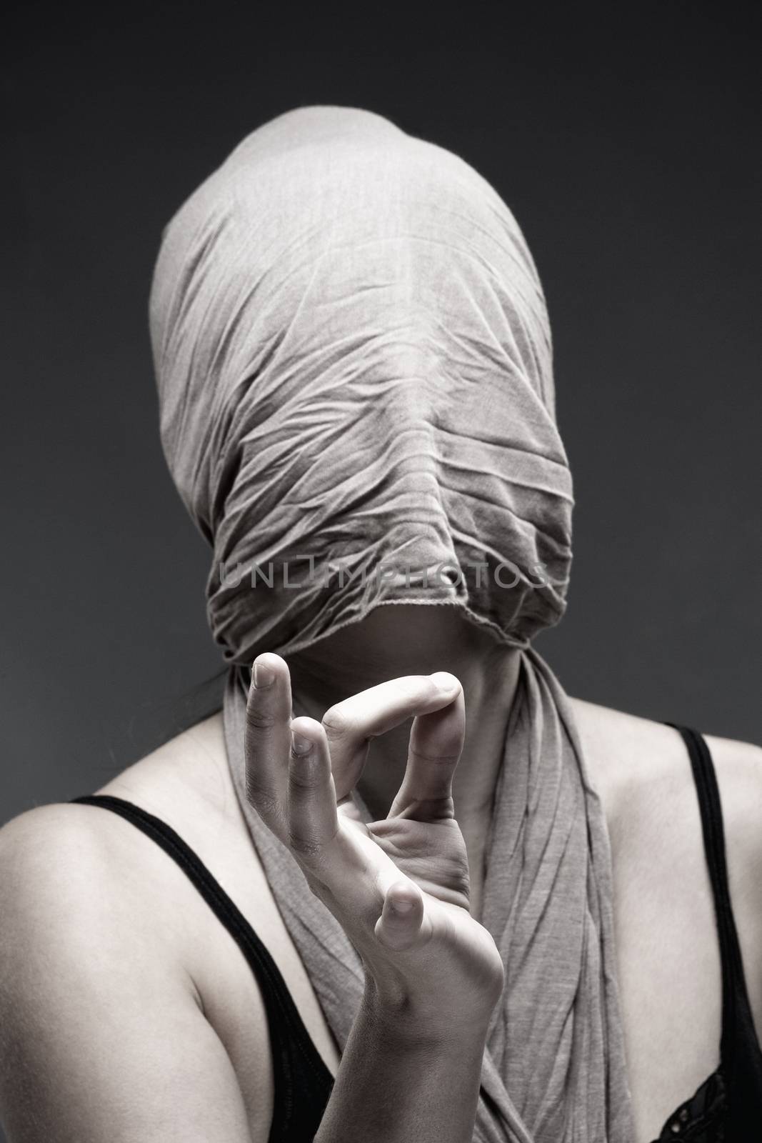Woman Covering Face with Cloth, Making Hand Sign with Fingers