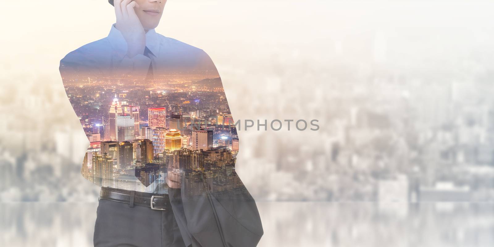 double exposure of businessman and city