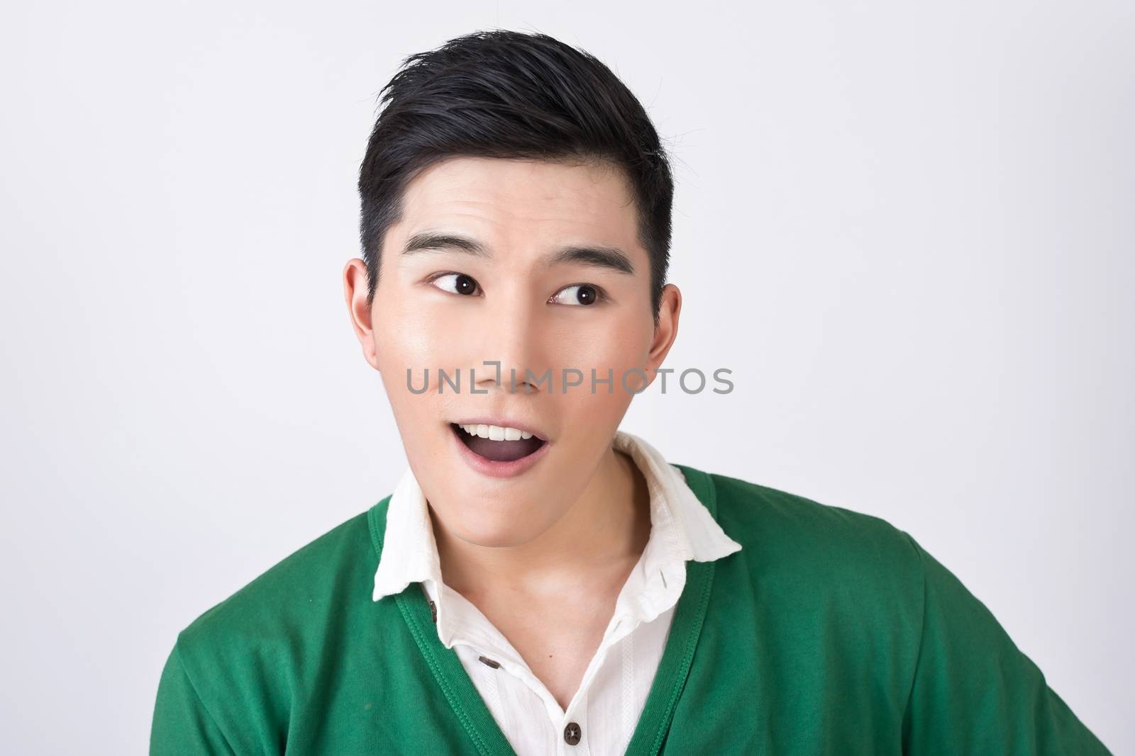 Funny facial expression, closeup Asian young man.