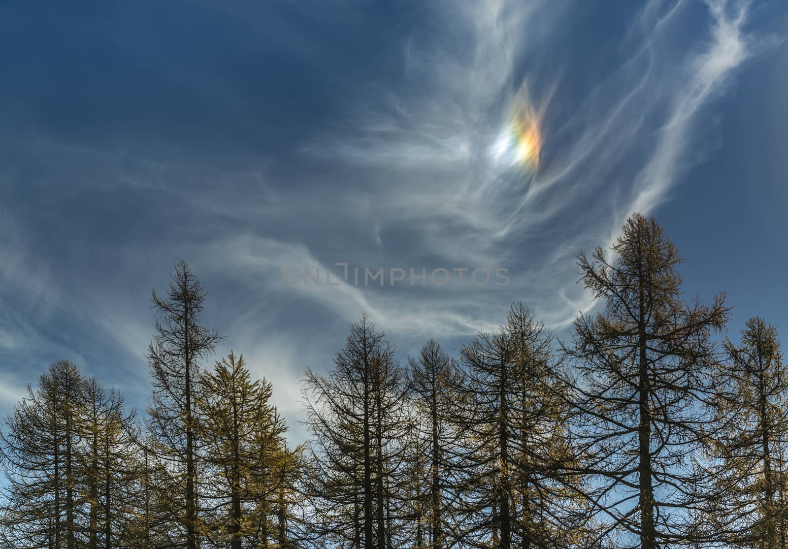 Parhelion in the autumn sky and clouds