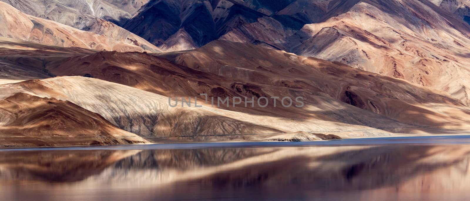 Tsomoriri mountain lake with fantastic mountains background and reflections in the lake (north India)