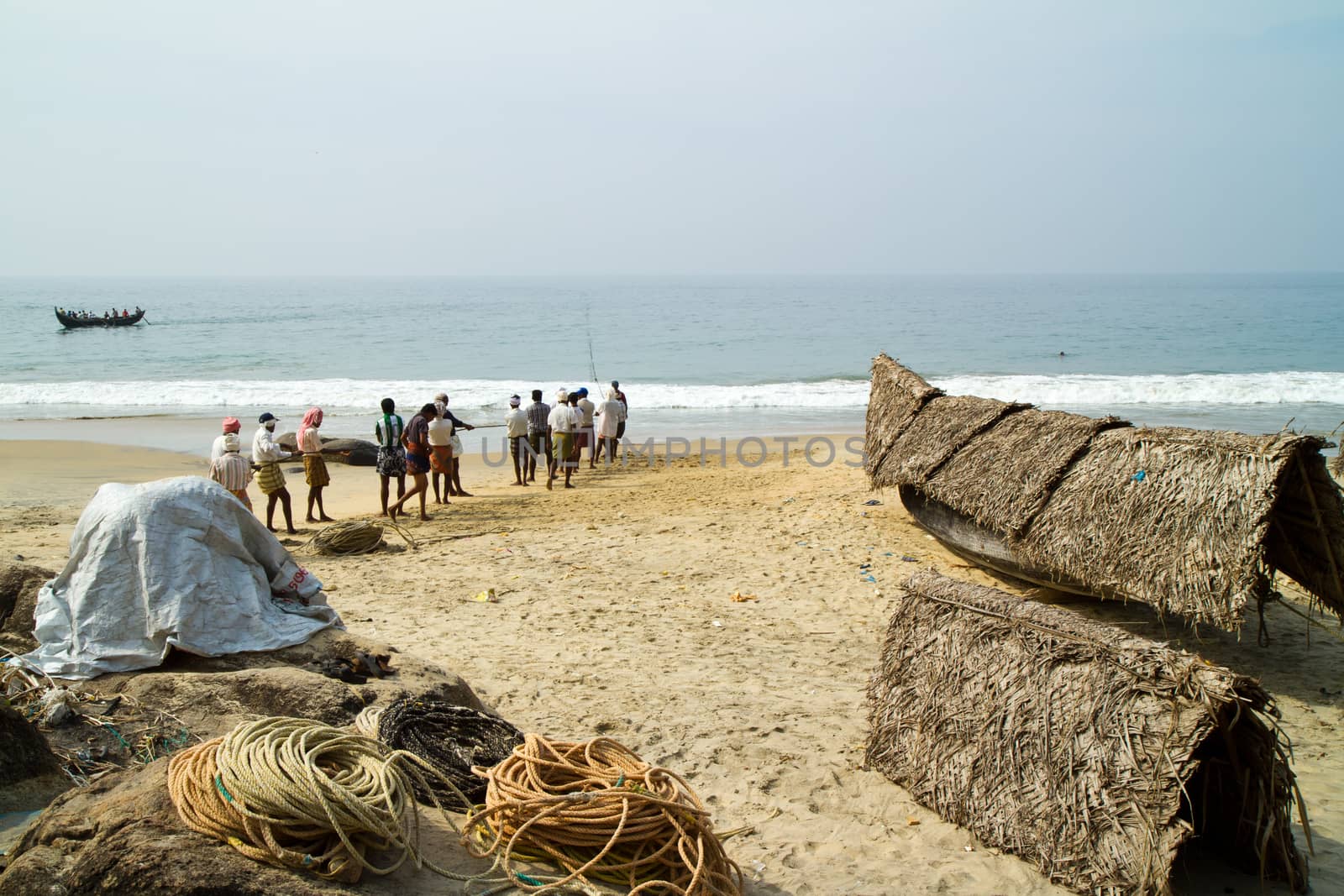 fishermen pulling a fishing net from the Arabian Sea by straannick