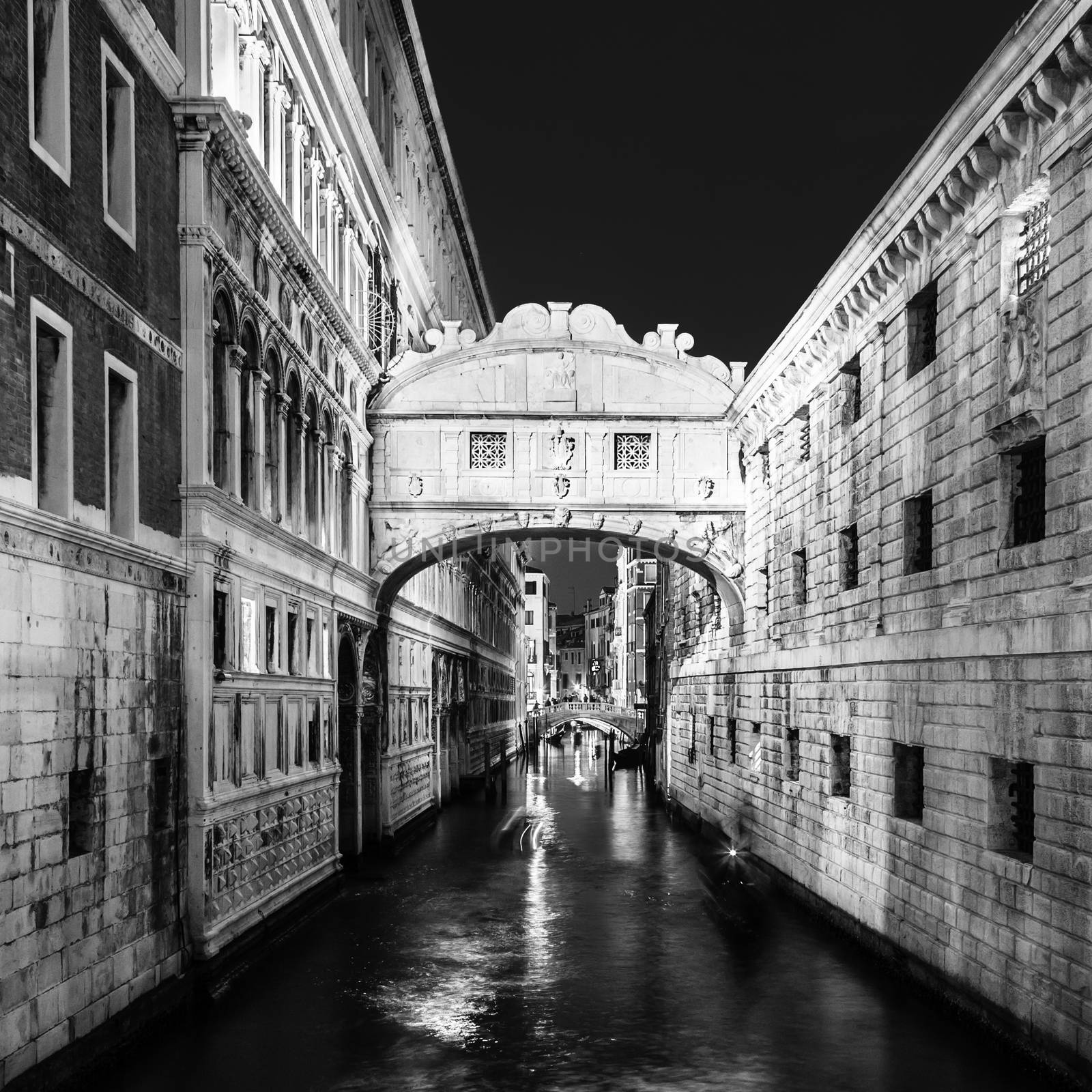 Gondolas passing under Bridge of Sighs, Ponte dei Sospiri. A legend says that lovers will be granted eternal love if they kiss on a gondola at sunset under the Bridge. Venice,Veneto, Italy, Europe. 