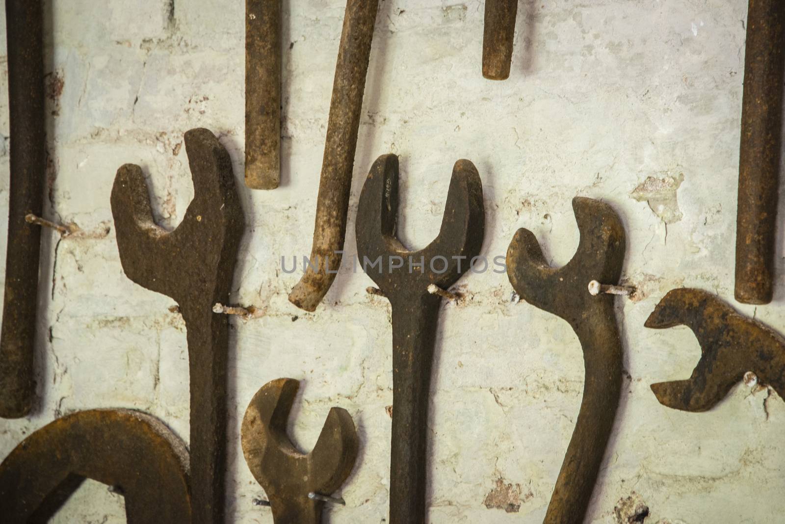 Antique spannners attached to a wall in a museum