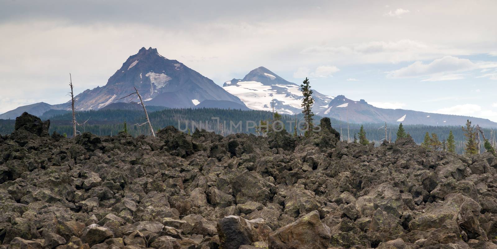 A seemingly endless field of lava leads out to the Sisters near Bend Oregon