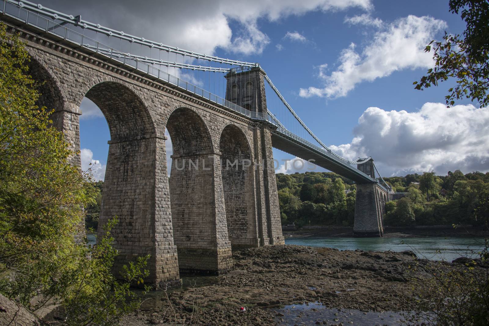 A view of the historic Menai suspension bridge spanning the Menai Straits, Gwynnedd, Wales, UK.