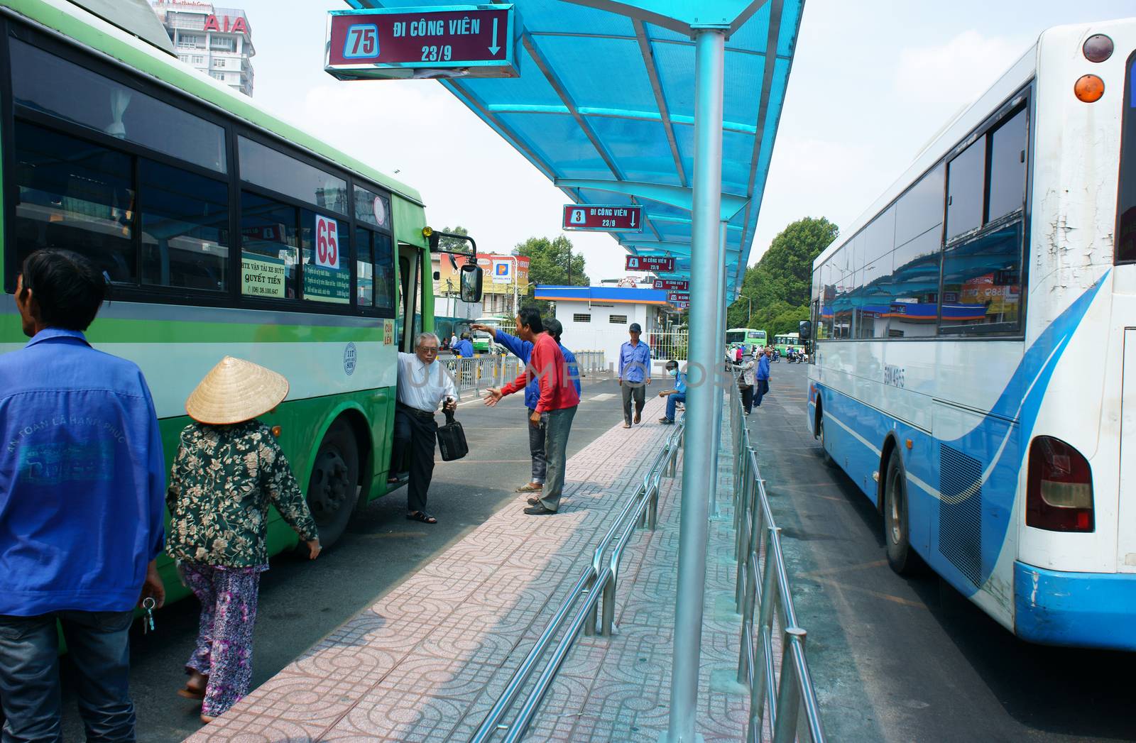 HO CHI MINH, VIET NAM: Passenger bus transport people in city, stop at Ben Thanh bus station, this public service center is place regulate activity for transportation by buses, Vietnam, April 16, 2014
