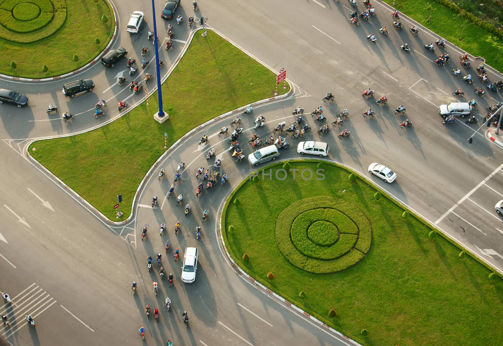 HO CHI MINH CITY, VIETNAM- MAY 9: Abstract scene of traffic in city on day, vehicle as motorbike, car moving cross crossroad, development of traffic infrastructure of Viet Nam, May 9, 2014