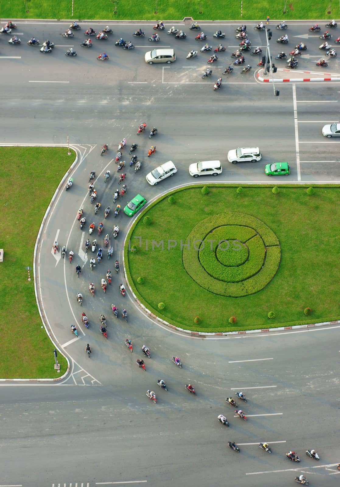 HO CHI MINH CITY, VIETNAM- MAY 9: Abstract scene of traffic in city on day, vehicle as motorbike, car moving cross crossroad, development of traffic infrastructure of Viet Nam, May 9, 2014