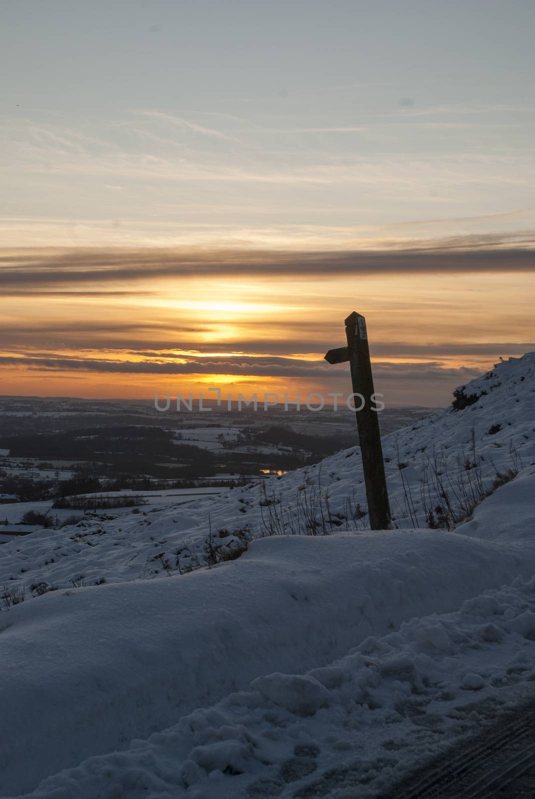Scenic snowy view from Ramshaw Rocks, Peak District, looking towards Leek, Staffordshire