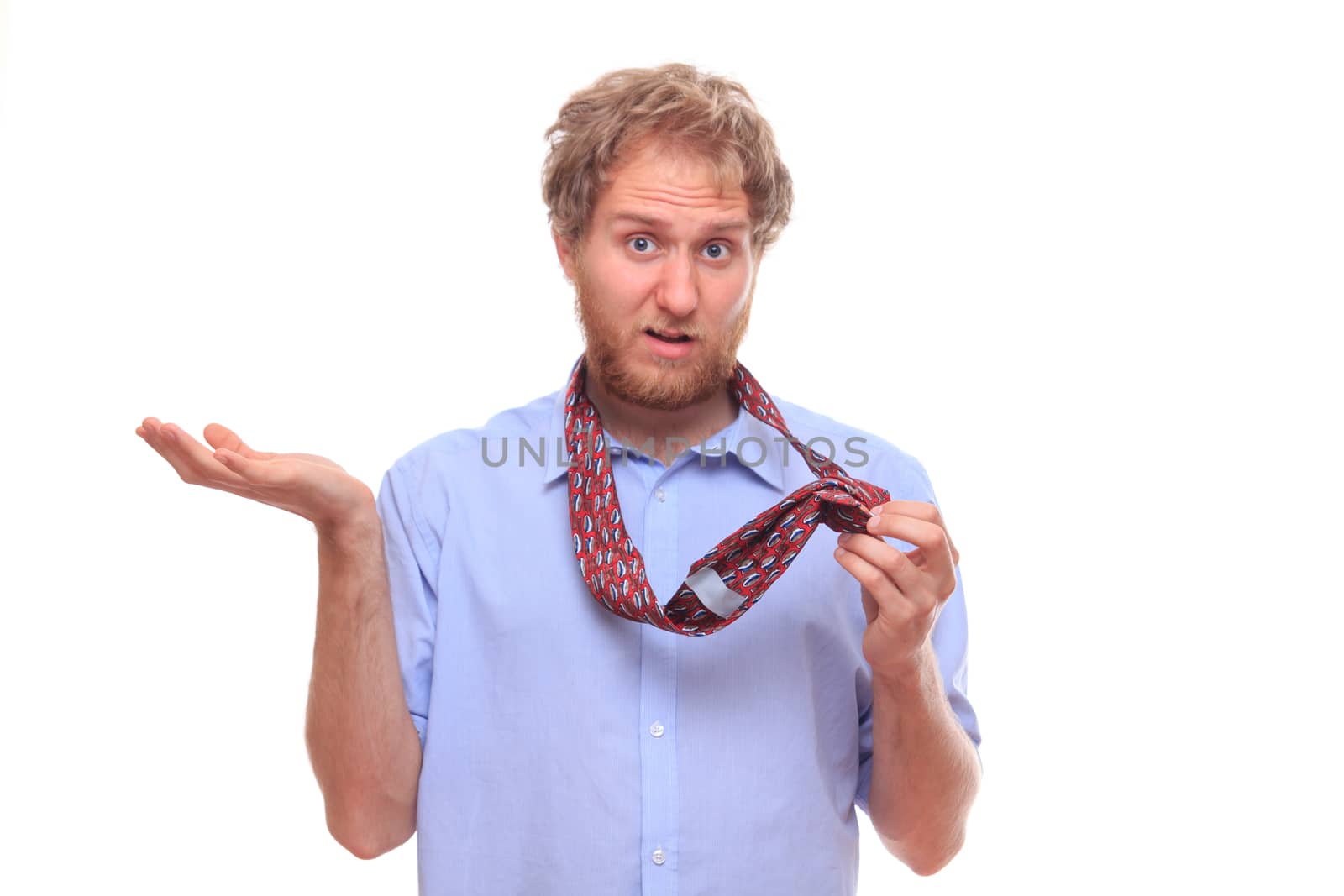 Man trying to tie a tie 