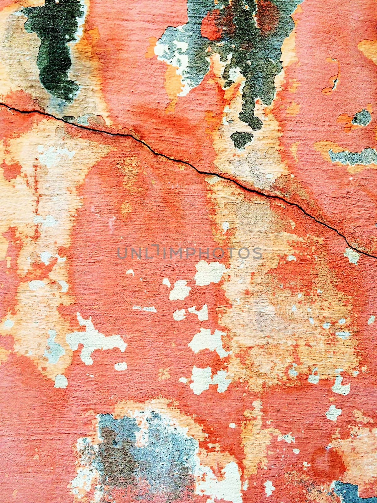 Cracked red wall with peeling paint by anikasalsera
