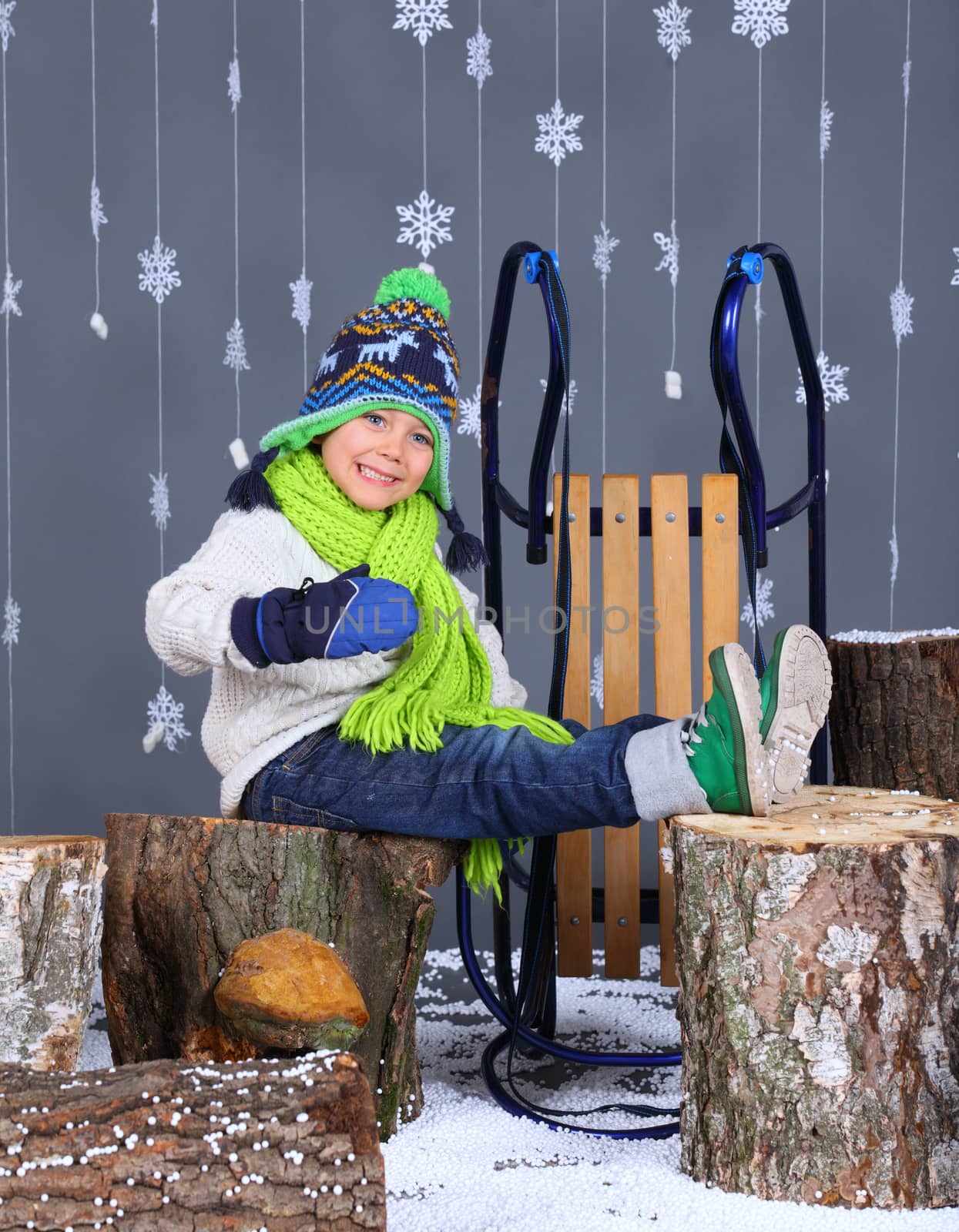 Winter Fashion. Portrait of adorable happy boy. by maxoliki