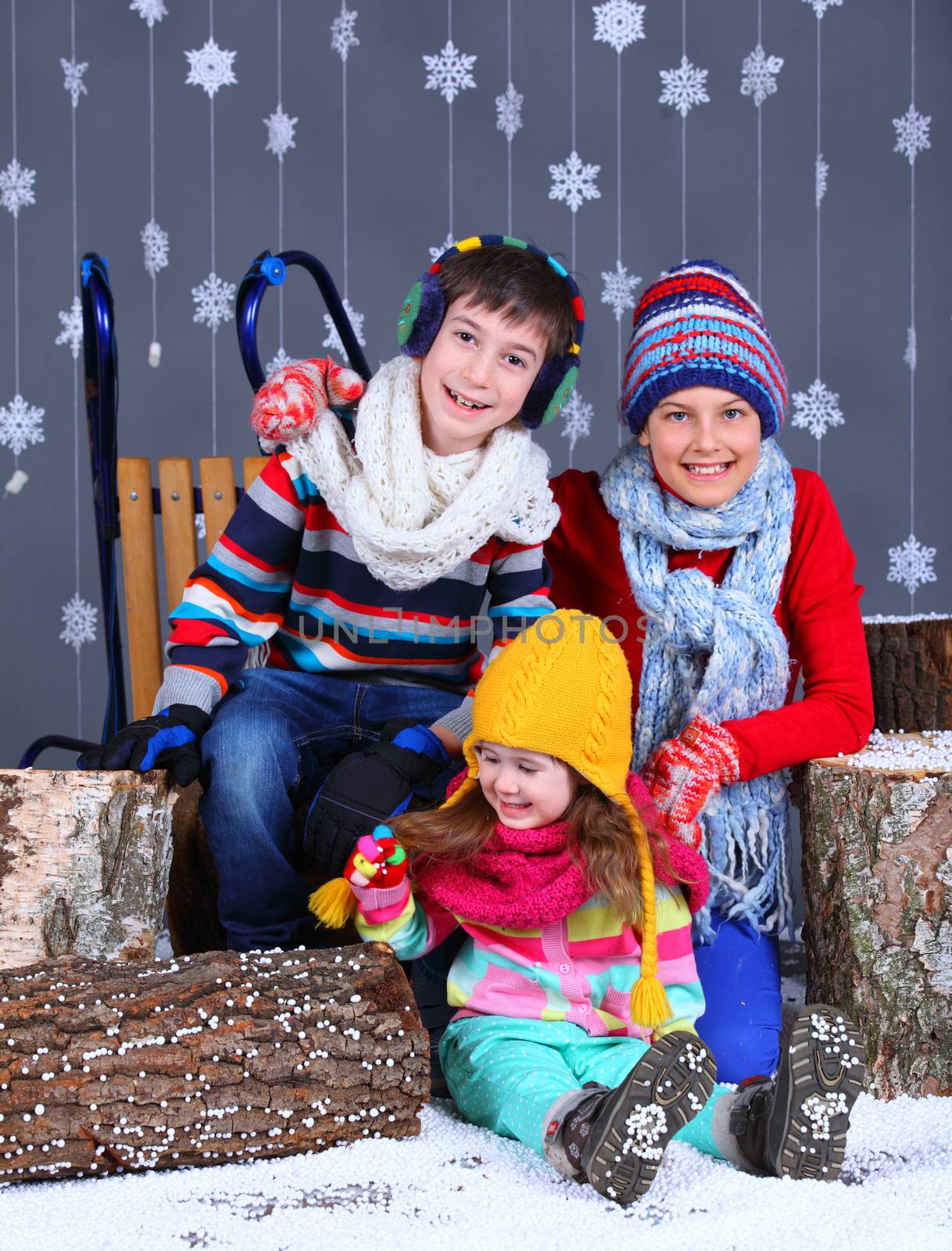 Winter Fashion. Adorable happy boy and girls. by maxoliki