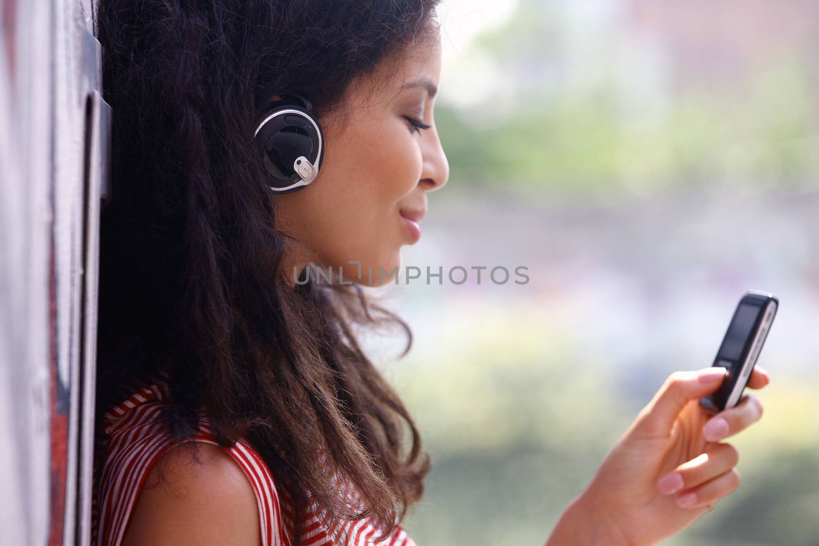 woman in headphones listen to music tui by toocan
