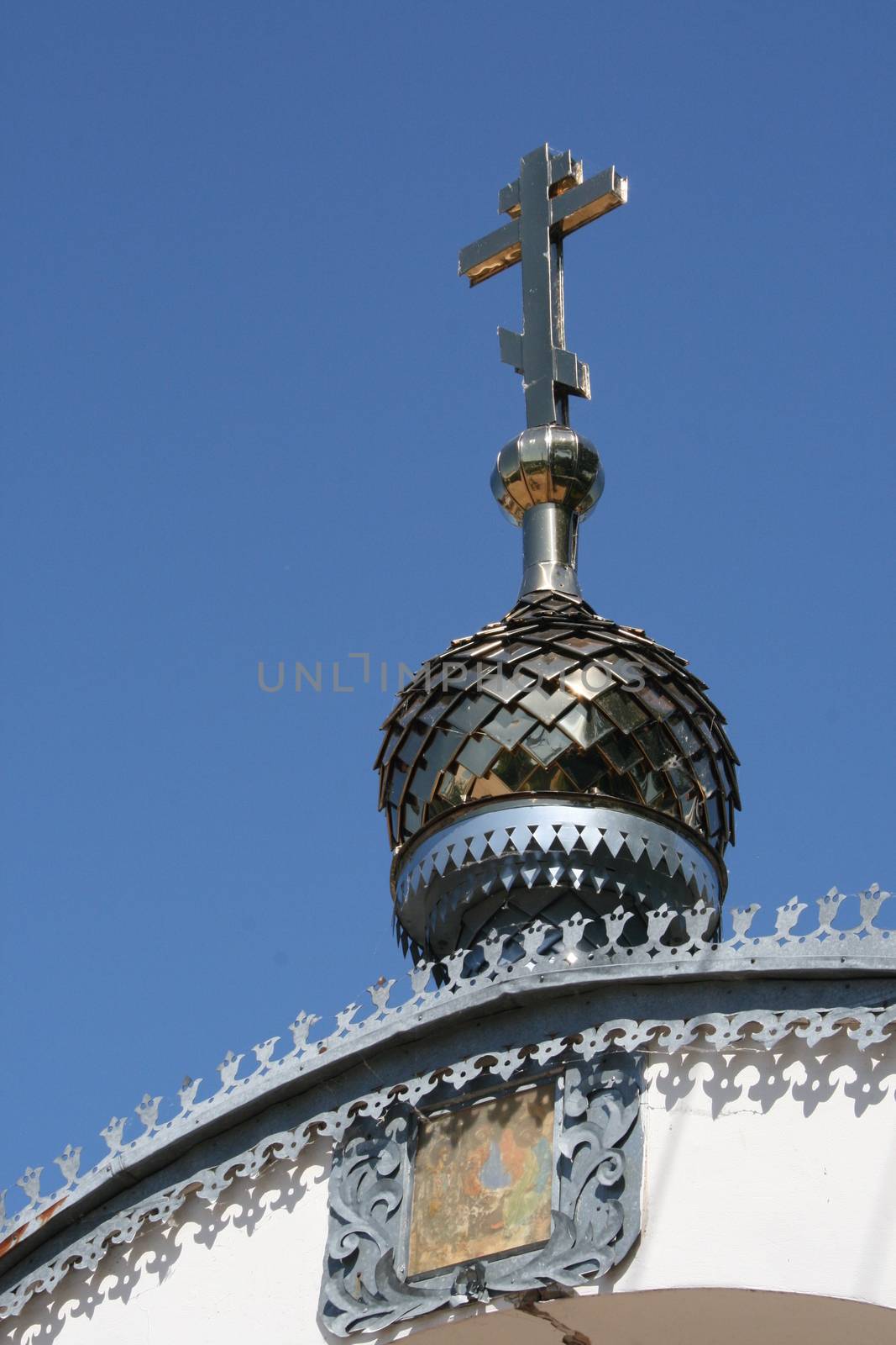 Metallic silver cross on the top of the Orthodox Church