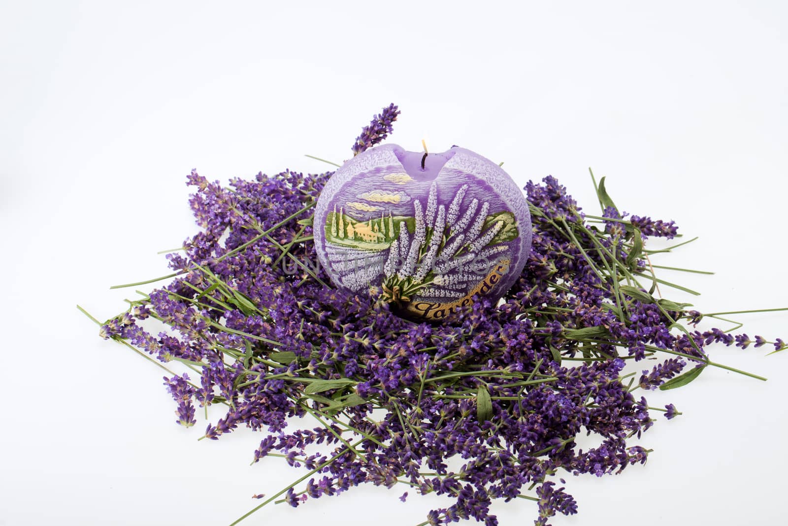  Lavender and candle  isolated on white background by wjarek