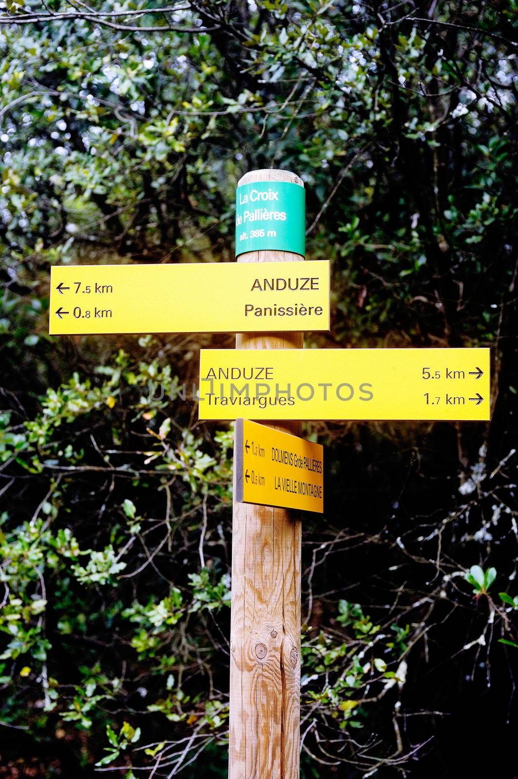 Sign indicating direction with the miles for each entry cities for hikers