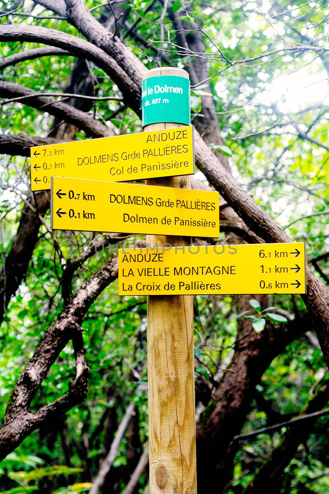 Sign indicating direction with the miles for each entry cities for hikers