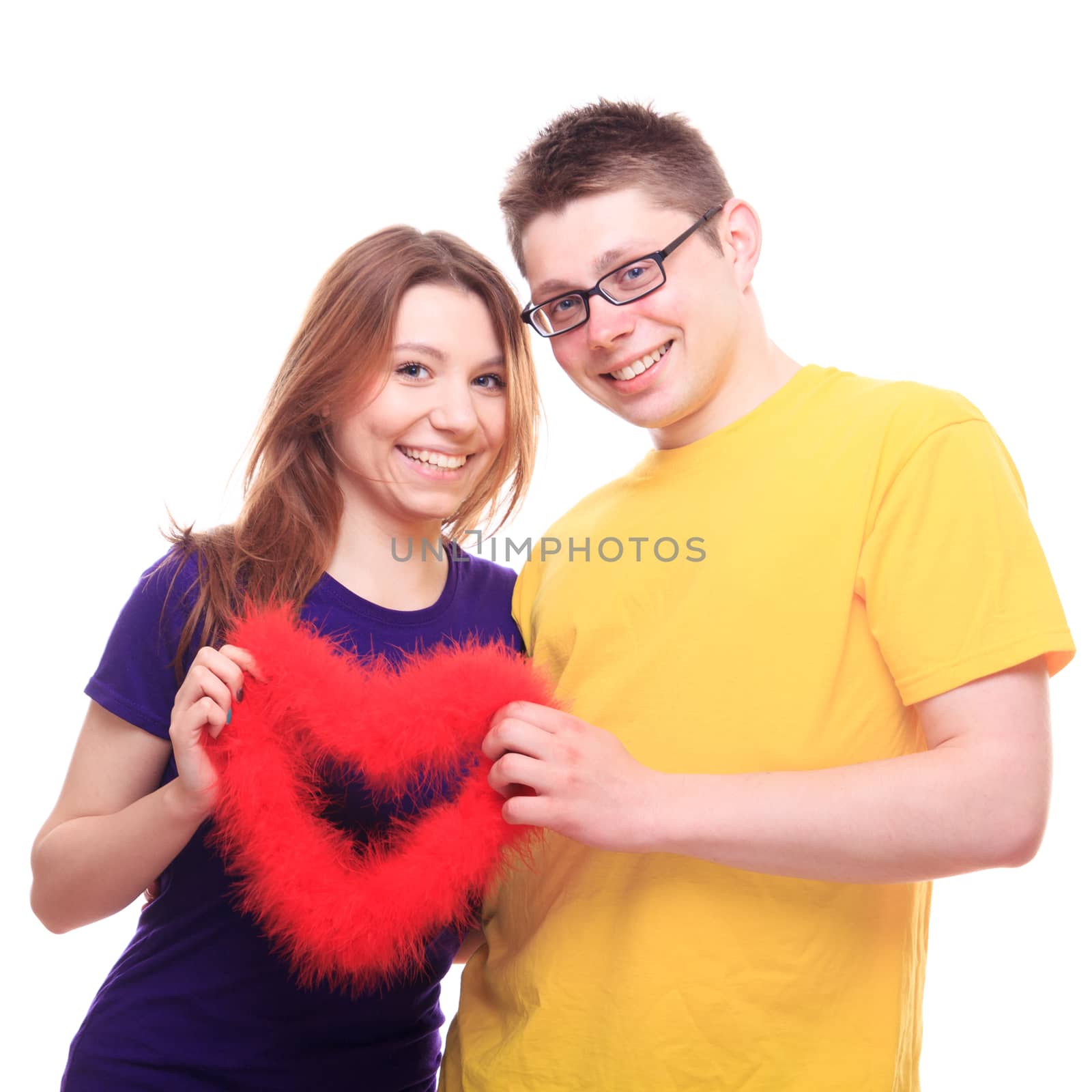 Young people in love holding heart - studio shoot 