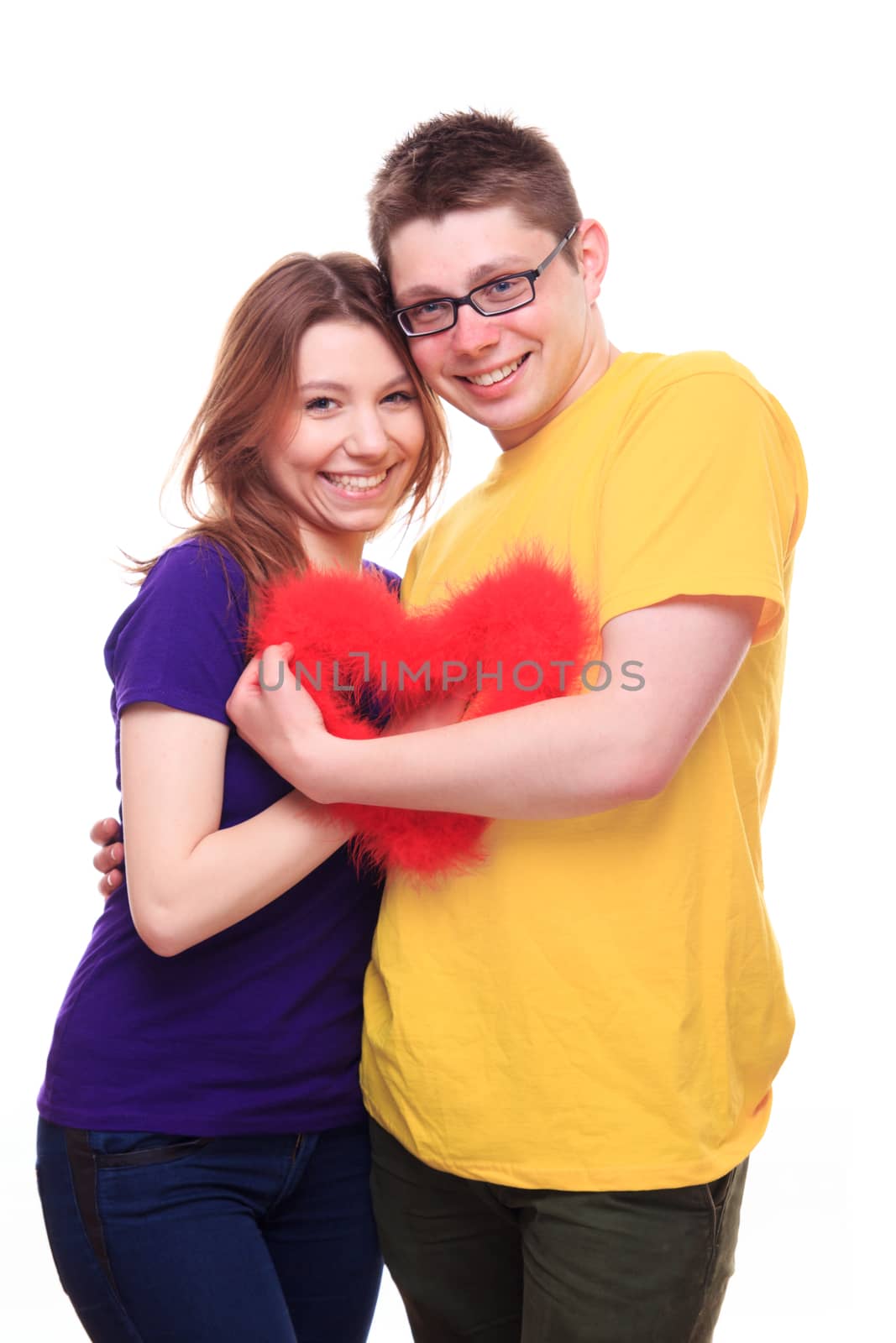 Young people in love holding heart - studio shoot 