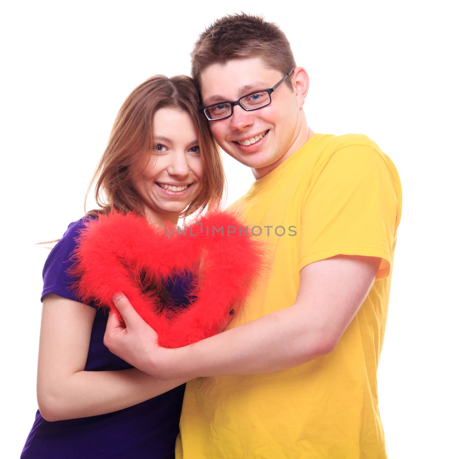 Young people in love holding heart - studio shoot 