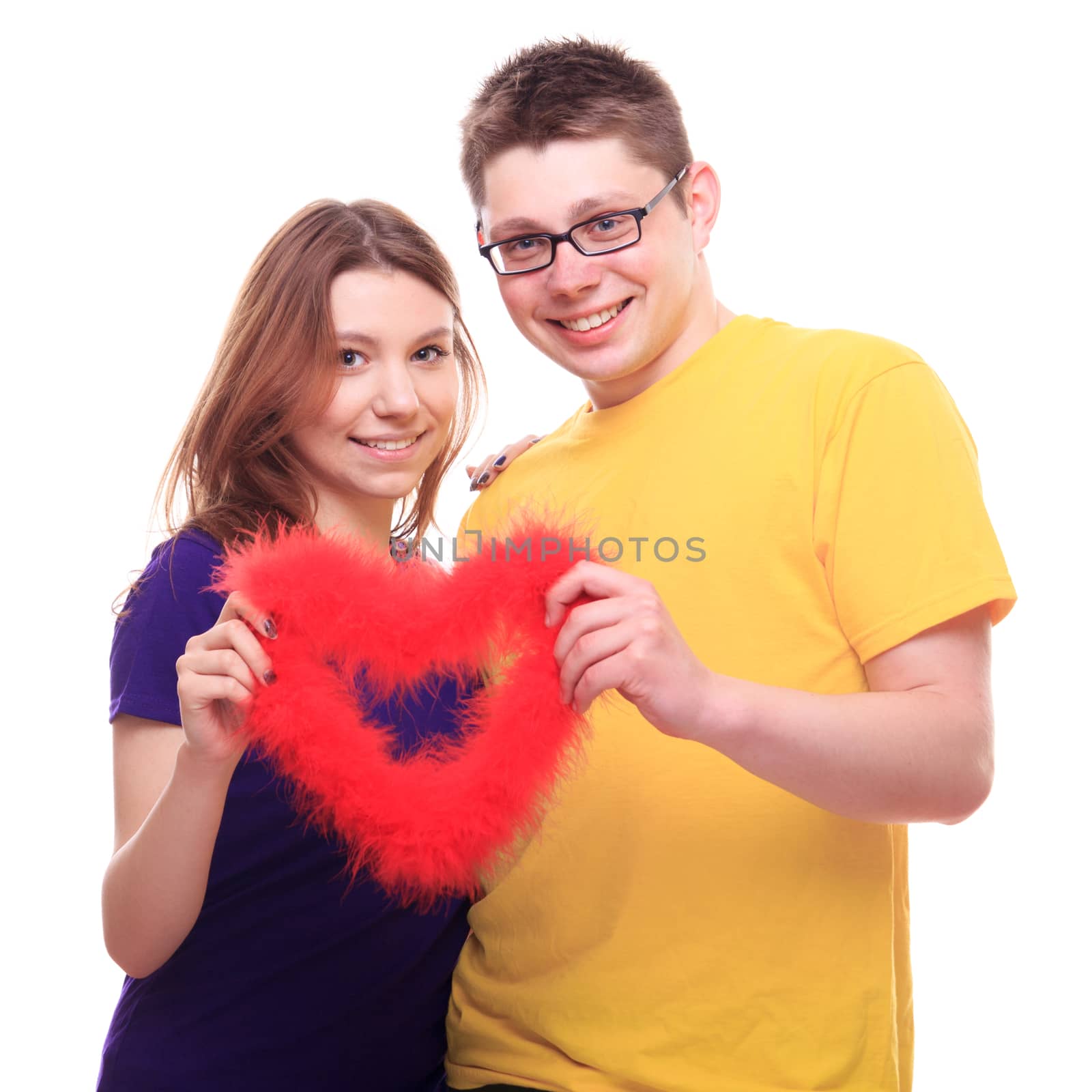 Young people in love holding heart - studio shoot 