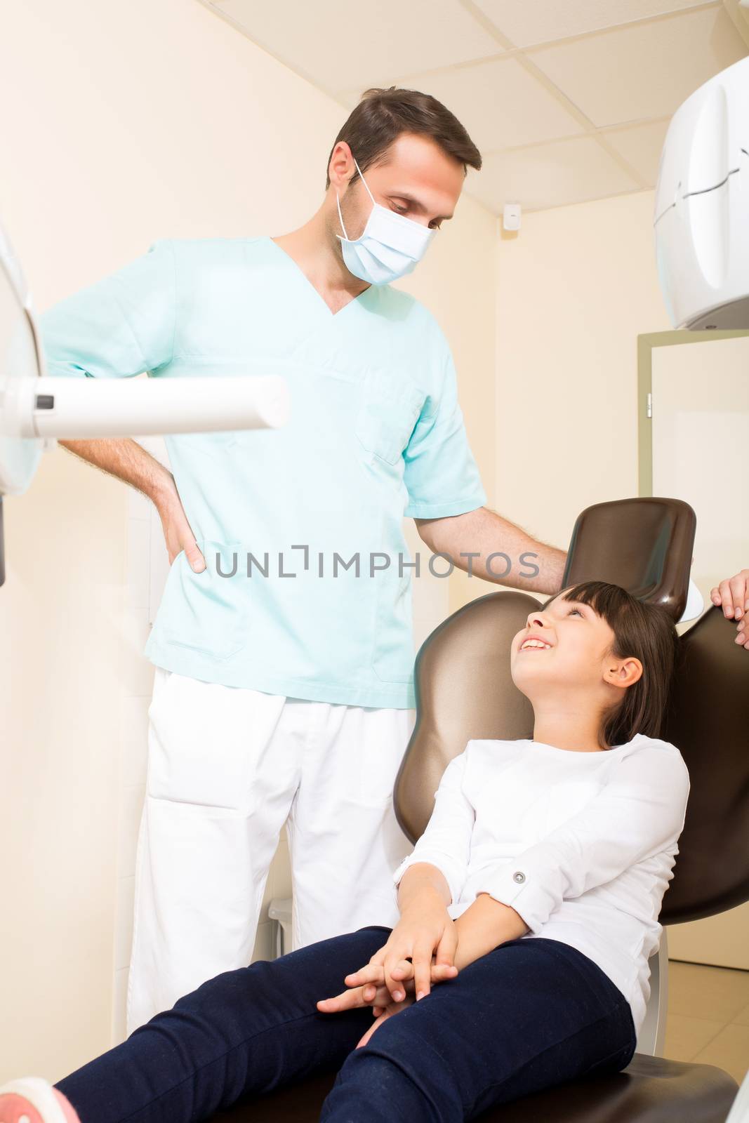 A little girl at the dentist before treatment.