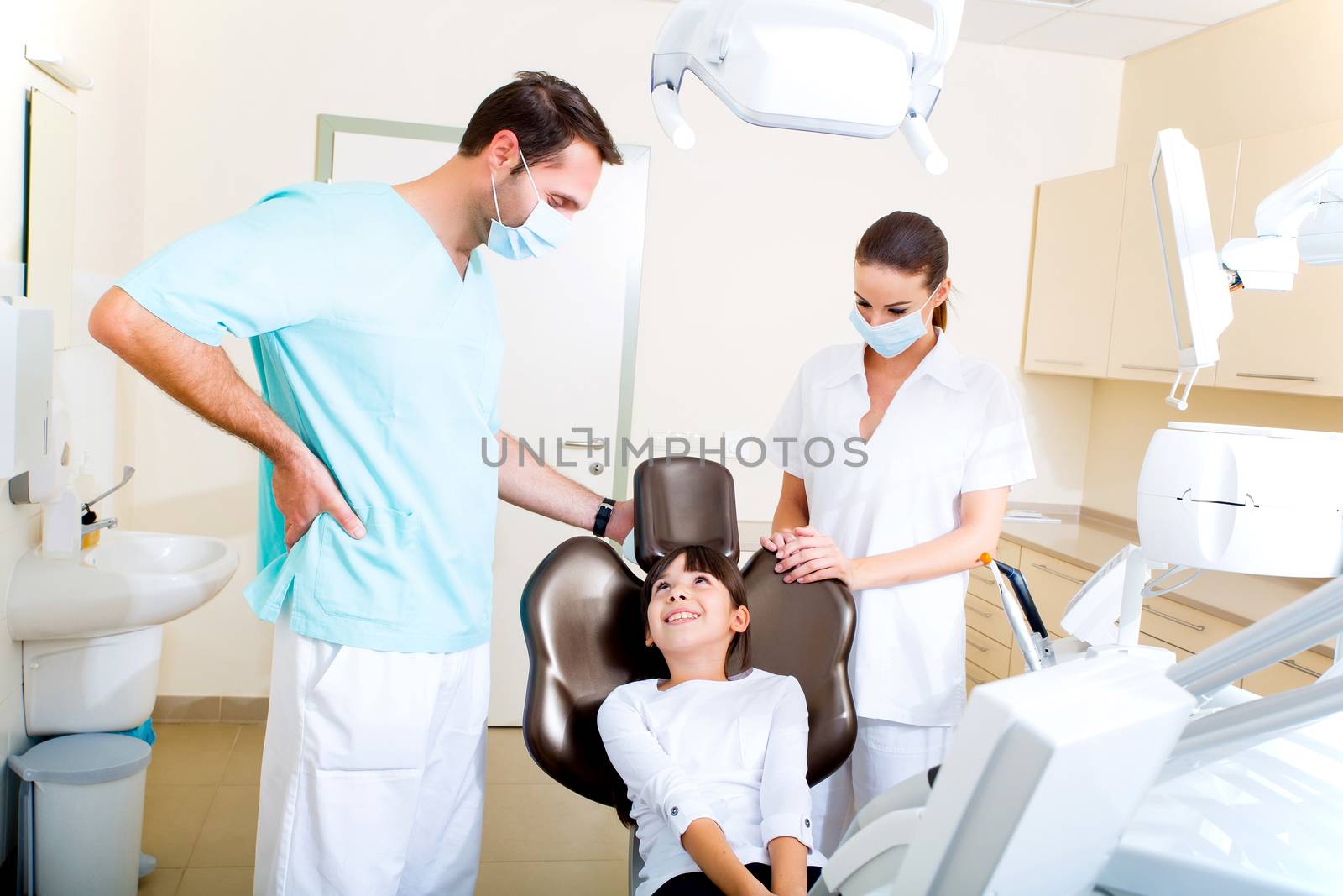 A little girl at the dentist before treatment.