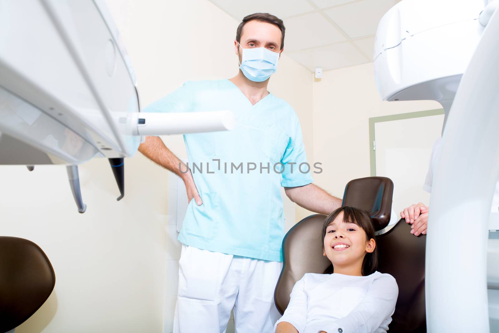 A little girl at the dentist before treatment.