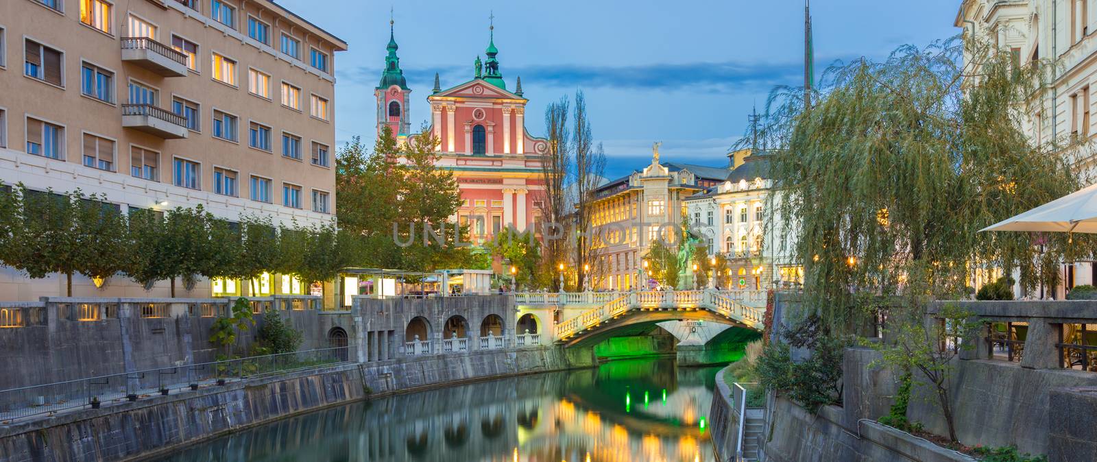 Romantic Ljubljana city center. River Ljubljanica, Triple Bridge - Tromostovje, Preseren square and Franciscan Church of the Annunciation. Ljubljana Slovenia Europe.