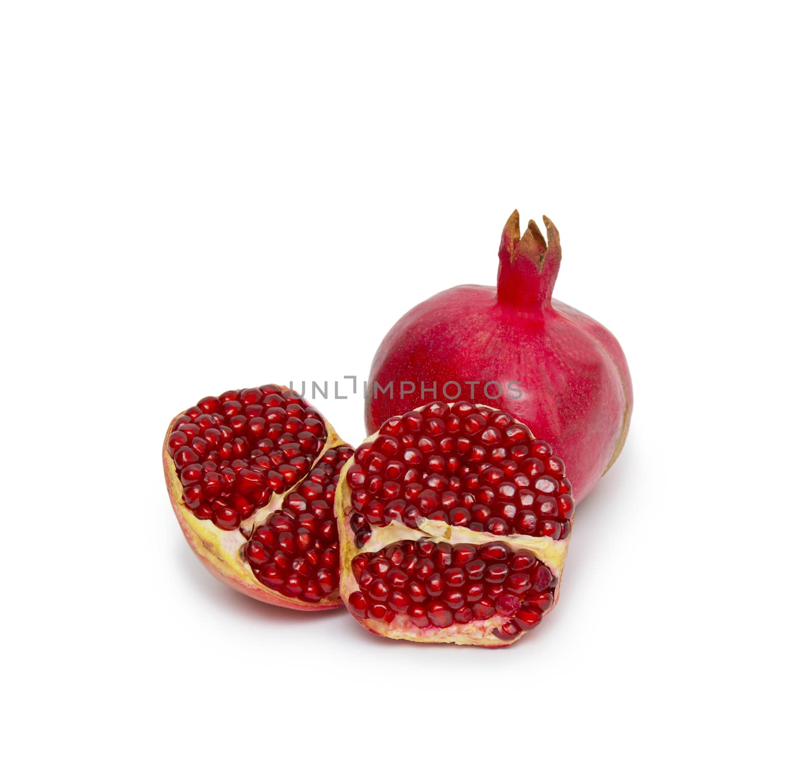 Ripe pomegranate fruit isolated on white background cutout