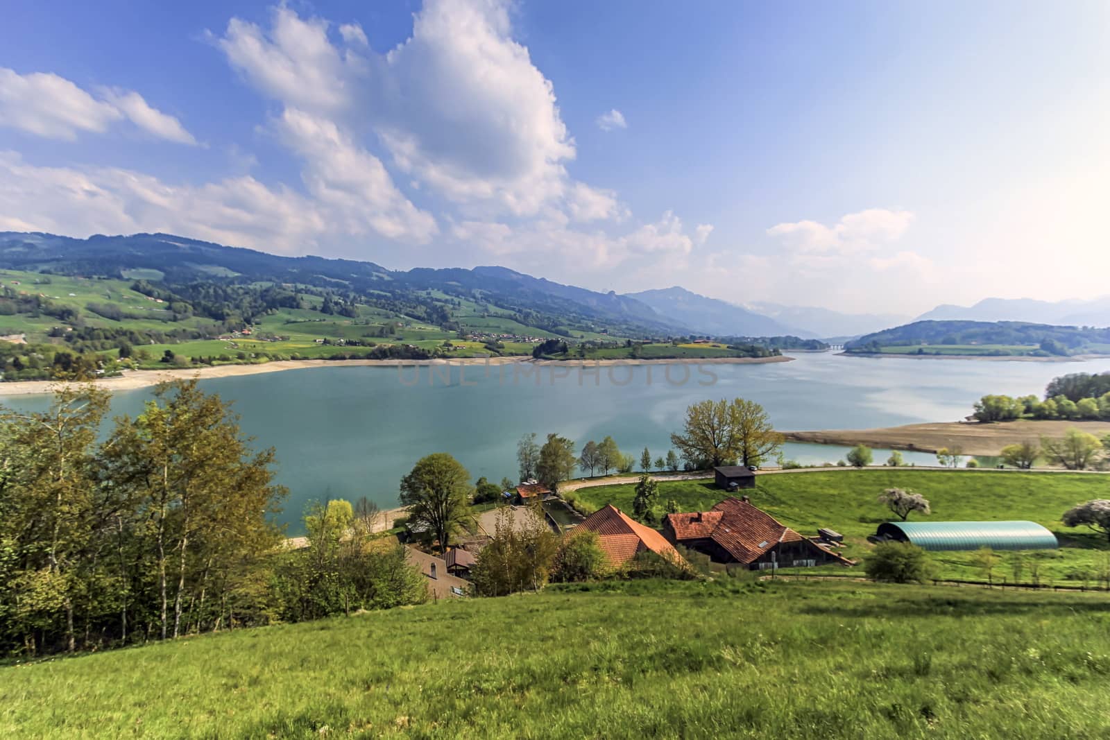 View on the lake of Gruyere by summer day, Switzerland