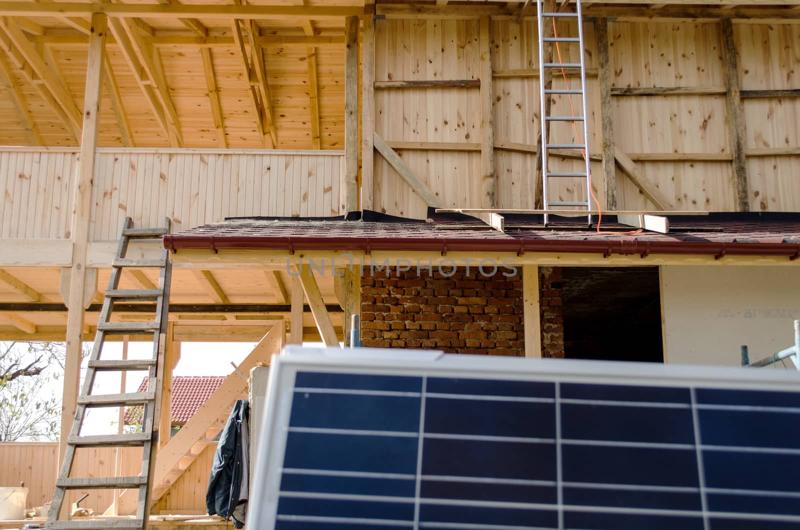 Solar photovoltaic panels mounted on a tiled house roof