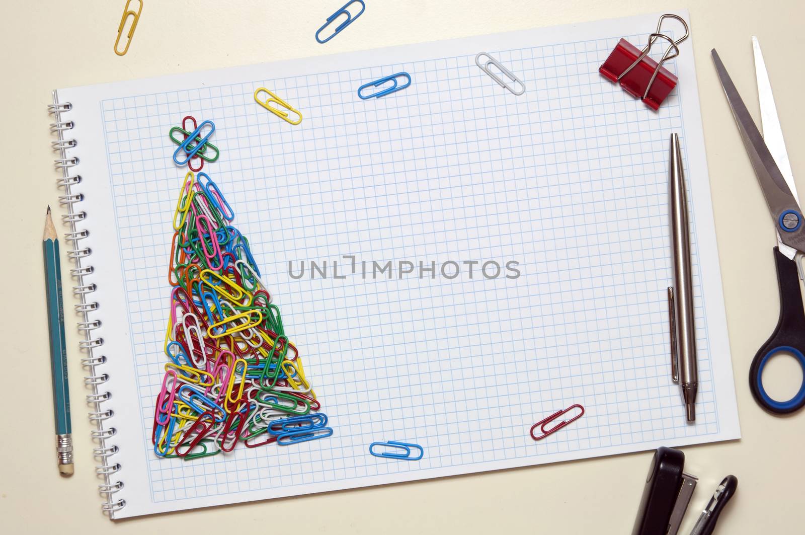 Christmas greeting card made of colorful clips and other office supplies