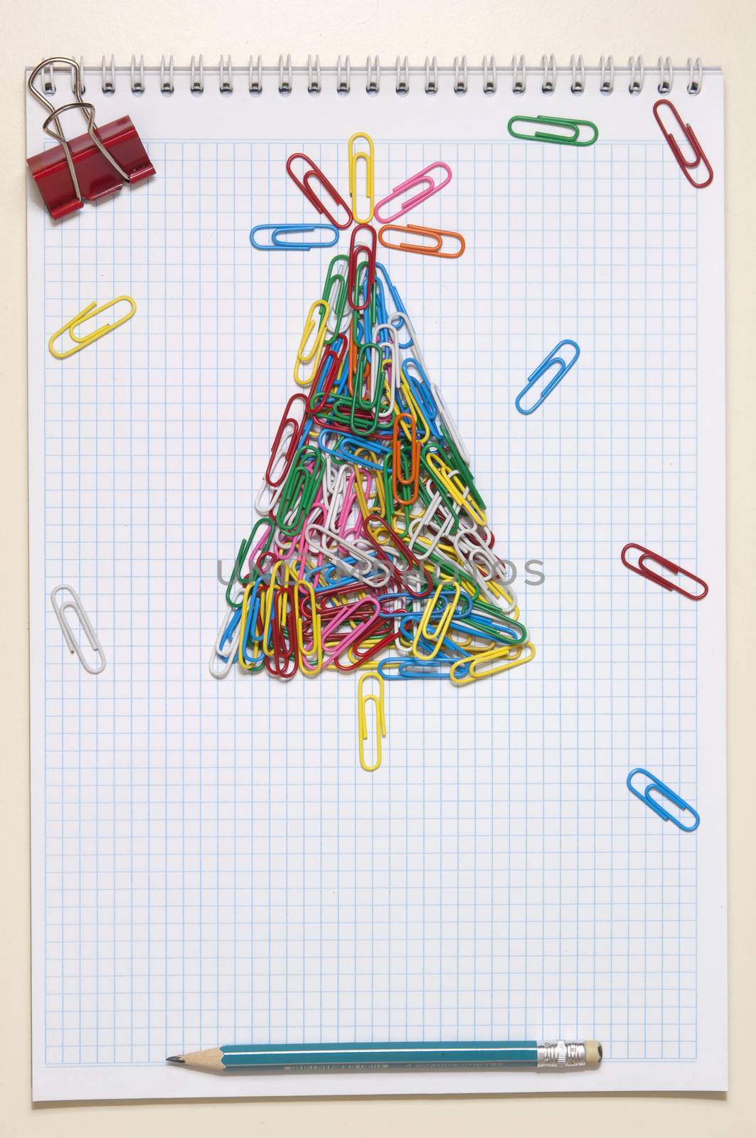 Christmas greeting card made of colorful clips and other office supplies