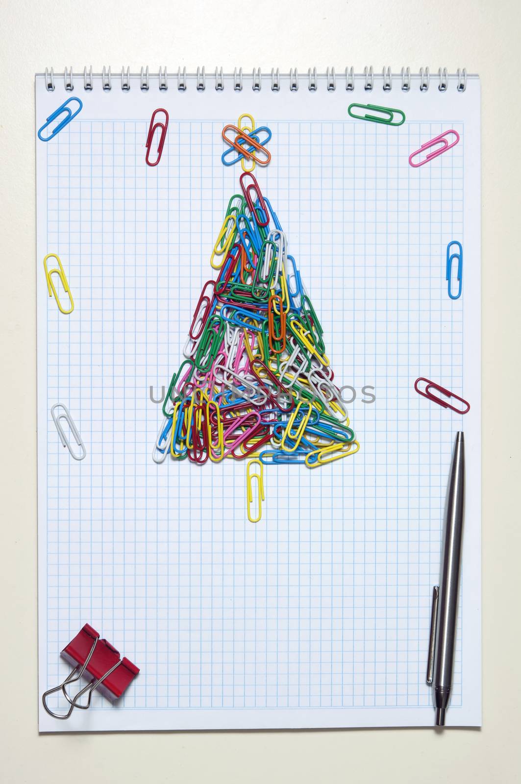 Christmas greeting card made of colorful clips and other office supplies