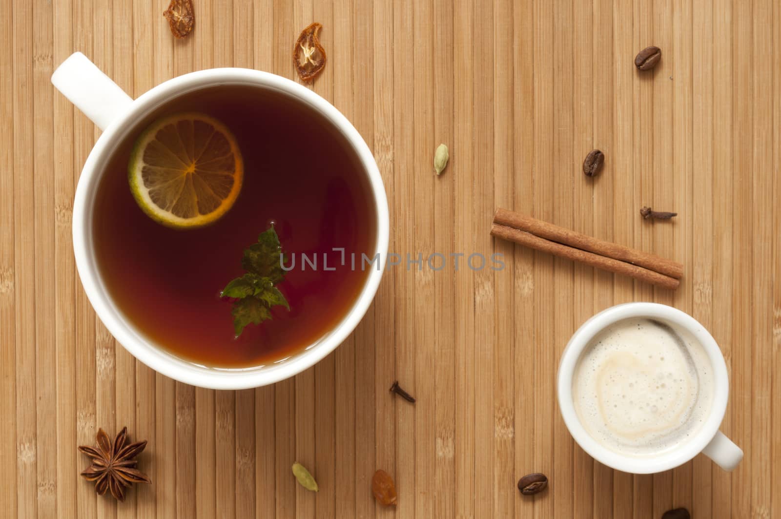 Cup of tea with lime, mint and cup of coffee with ice cream