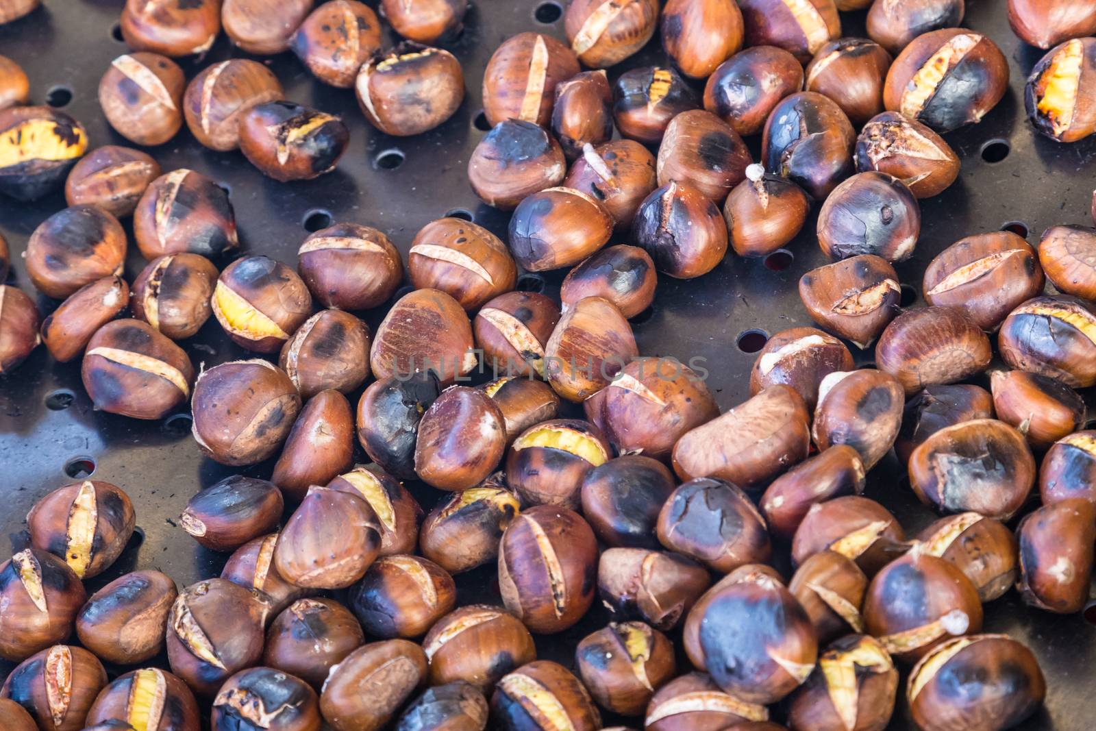 Grilled chestnuts being selled at stalls in autumn.