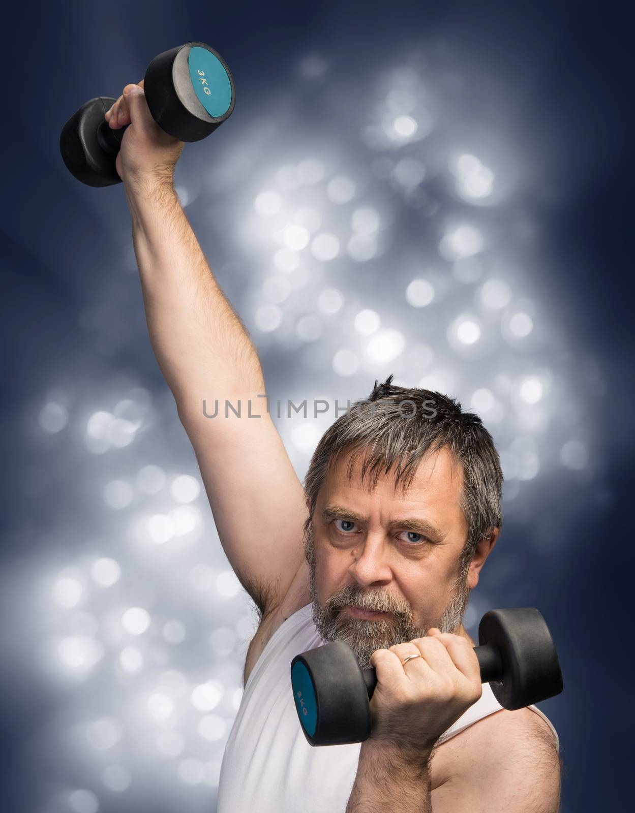 man exercising with dumbbells by palinchak