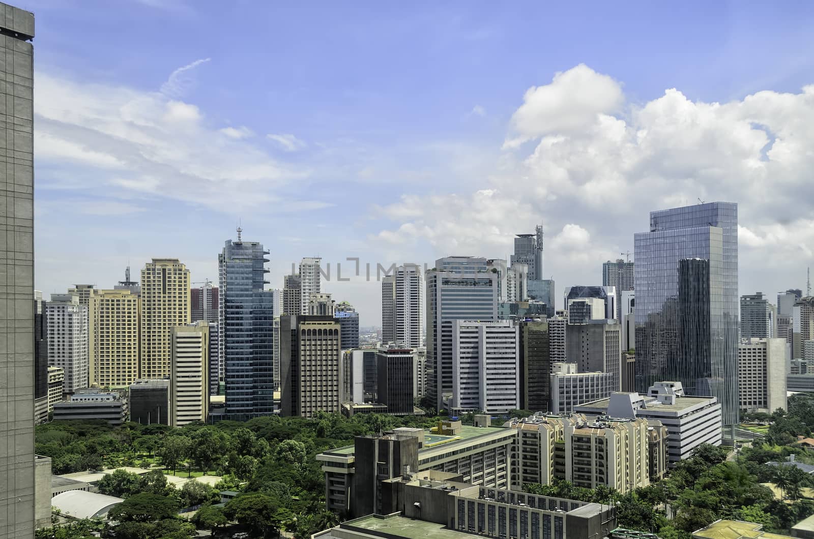 Mix of old and modern urban buildings in Makati City, Manila, Philippines